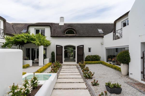 Experience the epitome of refined living in this luxurious Villa, perfectly positioned along the fairway of the acclaimed De Zalze ...