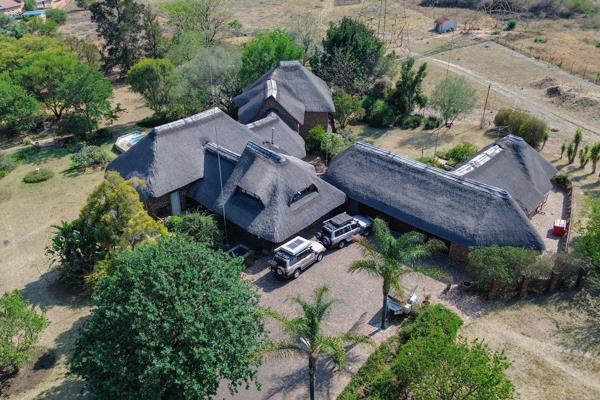 Encounter peaceful living in this beautiful double storey 5 bedroom thatched home in Mnandi
As one enters they are welcomed by a ...