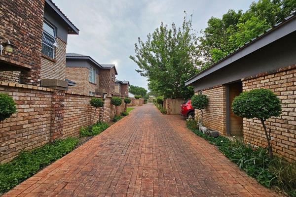 Dual Mandate
This stunning 3-bedroom, 3-bathroom duplex townhouse in Potchefstroom has it all! 

Step into the open-plan living space ...