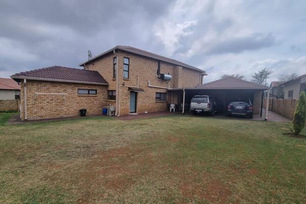 Downstairs.....Offers a lounge, kitchen with separate pantry and scullery, dining room, entertainment area with a built-in braai and a ...