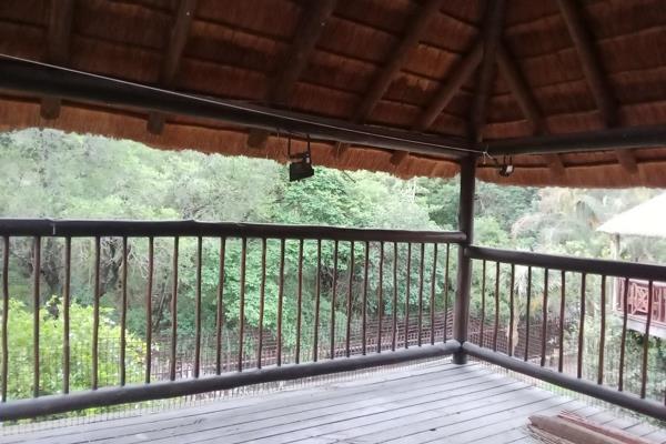 This 2-bedroom, 1 bathroom duplex with upstairs loft will make you think you are living in nature.


From the upstairs outside thatched ...