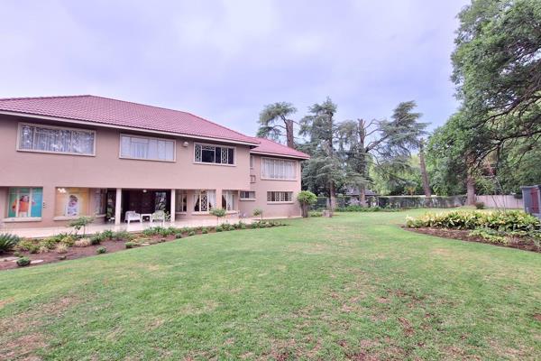 Step into this elegant family home featuring a wooden kitchen with two eyeline ovens, a glass hob, breakfast nook, and scullery. Enjoy ...