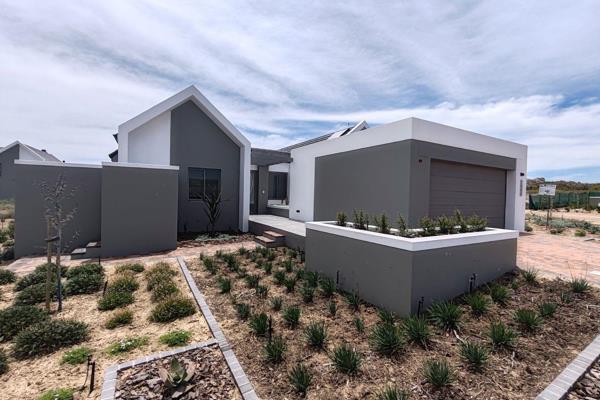 Step into refined living with this newly constructed, north-facing home, nestled in the ...