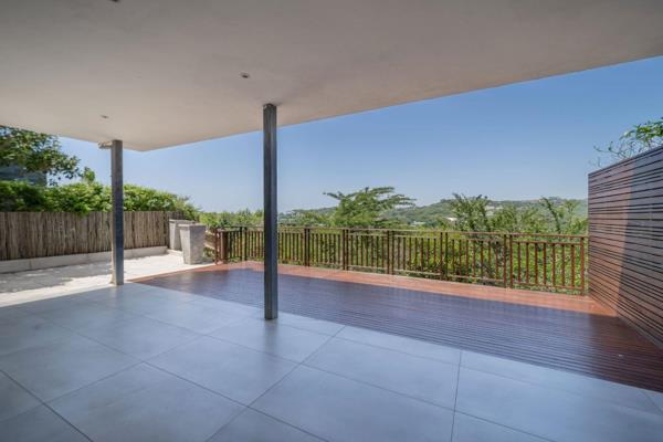 This dual-level residence boasts serene panoramic views from its spacious outdoor deck and upstairs covered veranda, as well as from ...