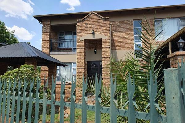 This double-story home in Lakeside Village, Modderfontein, is designed with facebrick ...