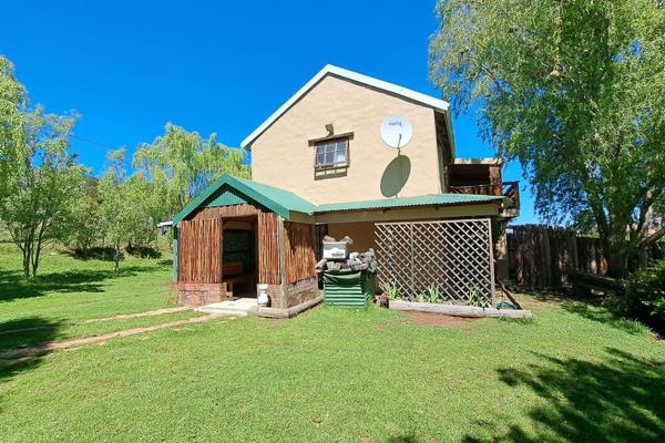 This charming two-story property is an ideal retreat, offering plenty of space and potential. The ground floor features a cozy living ...