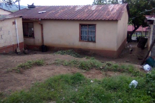 4 Room House with 2 bedrooms, lounge, kitchen and an outside bath with a shower and a toilet.