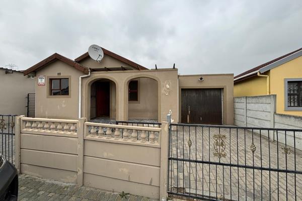 This cozy home welcomes you with an open plan lounge and dining space.

Kitchen fitted with built in cupboards

Features 2 ...