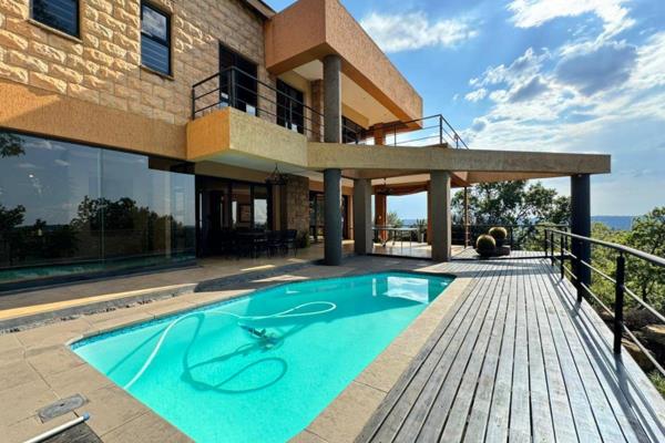 This spectacular home, set in an exceptional location with panoramic views over Pretoria ...