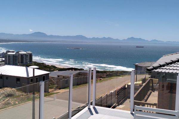 Enjoy breathtaking sea and mountain views from this luxury open-plan holiday home.

The modern kitchen, dining and lounge flows onto a ...