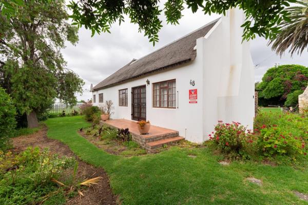 This enchanting thatch-roofed beauty exudes old-world charm and character, welcoming you with its spacious living areas effortlessly ...