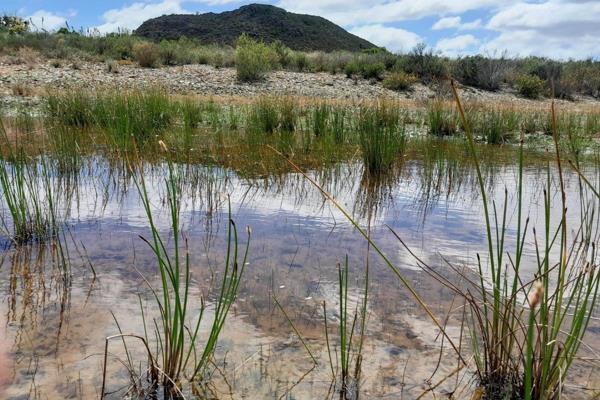 With TWO title deeds... You will find this gem, hidden away in the mountains, on an easy 4x4 track.  Situated close enough to town to ...