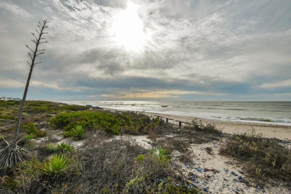 Prime Location! This beachfront property is poised to become your new home, where panoramic views of the beach and ocean stretch as far ...