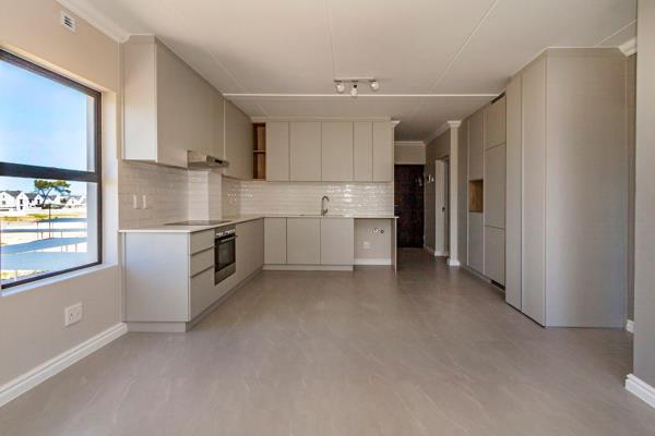 Enter into an open-plan kitchen and lounge that leads out onto the balcony, featuring a built-in braai.

This stunning unit comes with ...