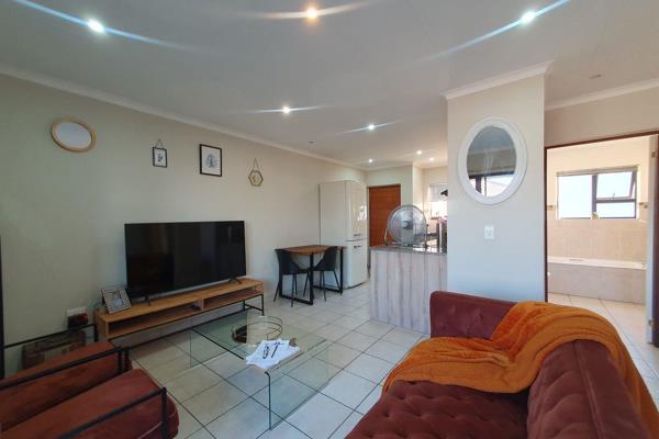 Discover the epitome of modern living in this delightful second-floor apartment boasting a charming balcony with built-in braai and ...