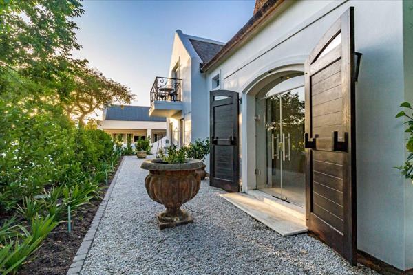 Nestled within the prestigious De Zalze Winelands Golf Estate, this exceptional residence combines timeless elegance with modern ...