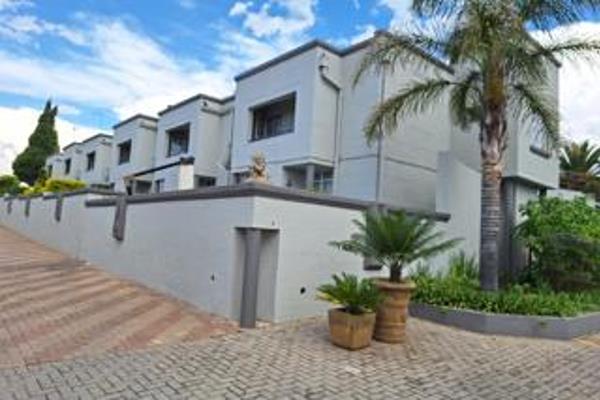 This trendy double-storey townhouse is set in a secure complex with 24-hour security.  ...