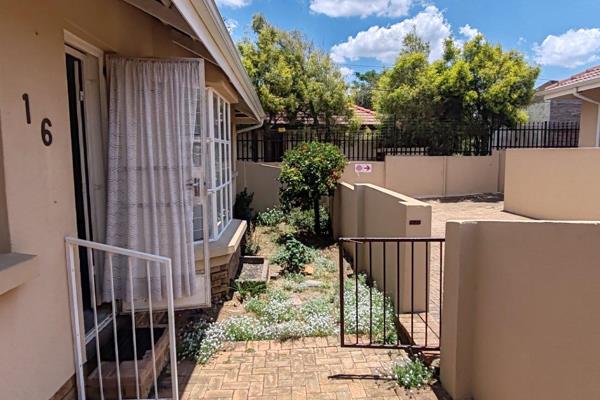 Elegantly designed townhouse with a private garden, located on a prime corner stand. ...