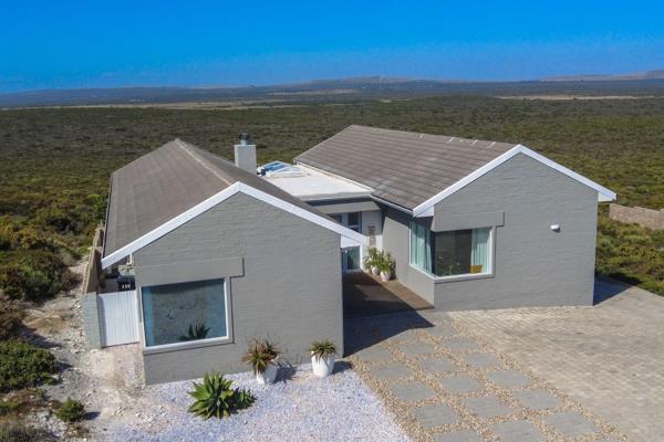 Exclusively presented:  Perched gracefully on the heights of Yzerfontein, this beach ...