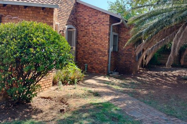 This charming Klinker brick home features an open-plan kitchen, lounge, and dining area, creating a seamless space for family ...