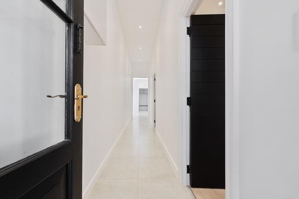 The property at 2 Salmon Road, Woodstock, Cape Town, is a modern 2-bedroom house with a functional and stylish design. It features an ...