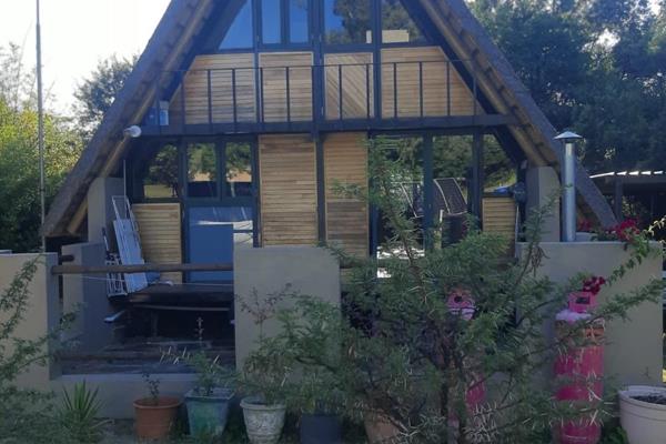 Off the Grid, A Frame, Thatch Roof Cottage on a large property. Tenant will have to be ...