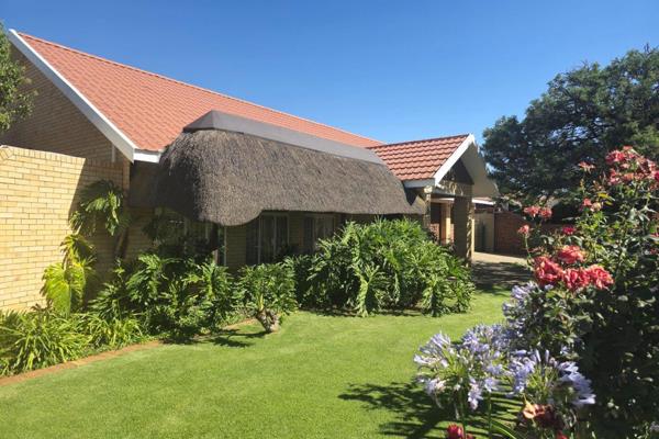 This lovely family home has a nice open plan living room that leads to an entertainment area with a built-in Braai. It has an open plan ...