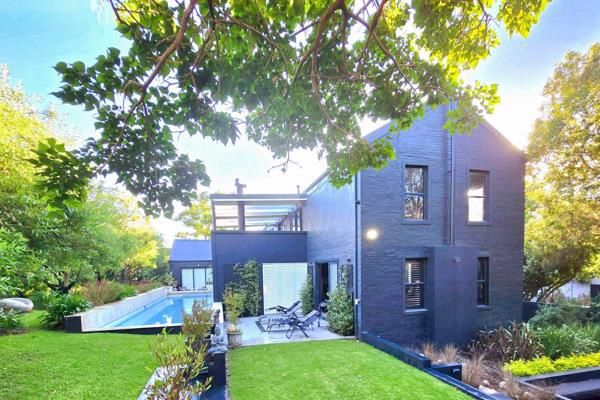 Nestled in the heart of nature, this exquisite countryside home is surrounded by a lush, mature garden that beautifully complements the striking, black-painted exterior. Designed with sophistication and practicality in mind, this ...