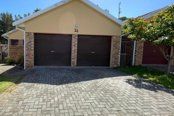 This lovely townhouse is located in a secure complex, with remote access. A double ...