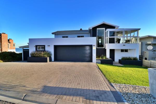 This beautifully designed family home in the sought-after Pearl Bay area offers ...