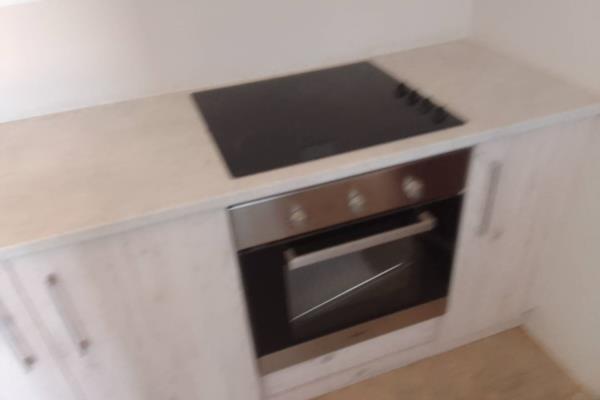 Newly built three bedrooms house, one bathroom, kitchen furnished with BIC four plate stove with under counter oven at an open plan ...