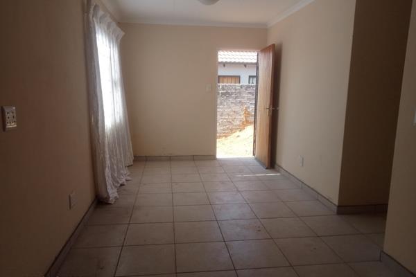 This newly built three-bedroom home, situated along the N12, boasts tiled flooring and is encased by a secure high wall. 

The property ...