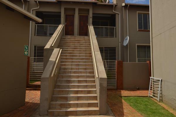 This first floor unit is located in a secure complex in Florida Glen. The patio has a built in braai and has a counter for food ...