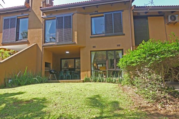 Comfortable villa opening through sliding doors onto lawn. Reception rooms comprise ...