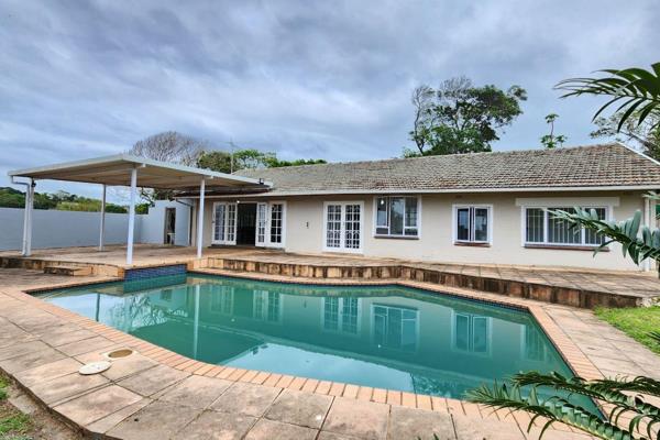 Nestled just moments from the popular Umtentweni Beach, this spacious 5-bedroom home ...