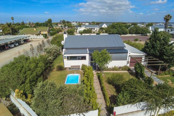 Step into this delightful home where classic charm meets coastal living. With a lovely ...