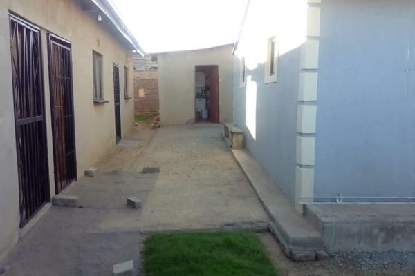 Consists of 2 bedrooms lounge kitchen toilet and bathroom  4 outside rooms, spacious yard, and fully walled with secured Gate