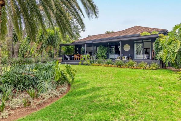 A stunning Transitional Home (Modern mixed with Traditional), perfectly blending indoor and outdoor living with a charming garden view. ...