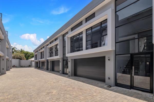 Step into the ultimate in modern living with this brand-new duplex home, ideally located ...