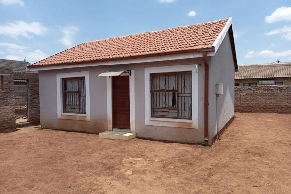 This neat home consists of two tiled bedrooms, a tiled bathroom with a shower, a tiled lounge, and a tiled kitchen with a stove. The ...