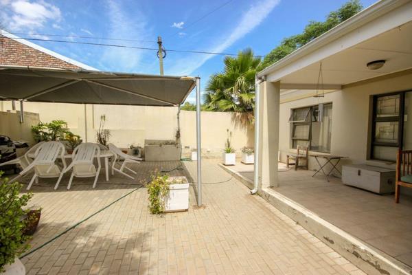 This property is located in a small, secure gated complex, offering a private living environment. 
The house features three spacious ...