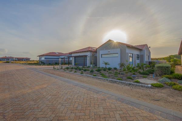 EXCLUSIVE SOLE MANDATE - Step into this stylish and inviting 4-bedroom family home located in the prestigious Langebaan Country Estate. ...