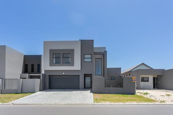 Discover this brand-new, thoughtfully designed family home in the serene and sought-after Sandown neighborhood of Cape Town. Designed ...