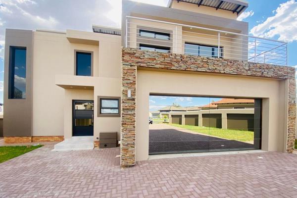 Step into luxury living with this stunning property located in the prestigious Helderwyk Estate.

As you enter, you’ll be welcomed by a ...