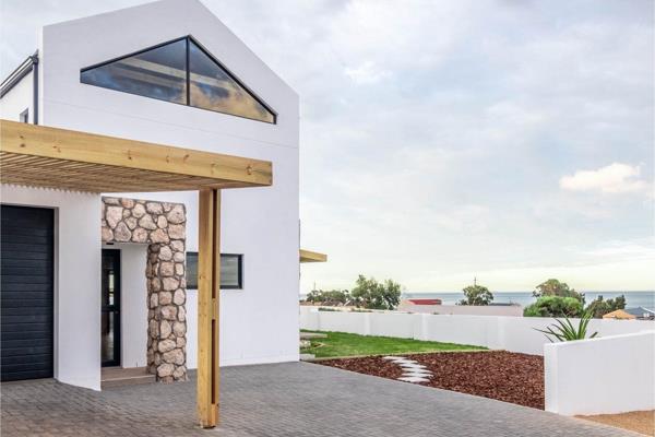 This stunning, newly built home offers modern living in a secure estate at a price of ...