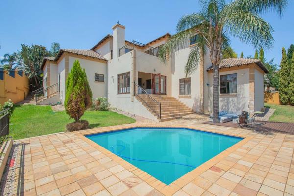 his exquisite property is located in the highly coveted Ruimsig Country Estate, a ...