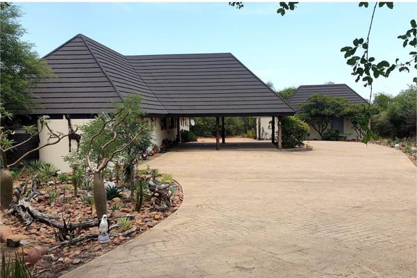 You enter this property via a beautiful casted concrete road, all aligned with indigenous plants and trees, winding its way to an ...