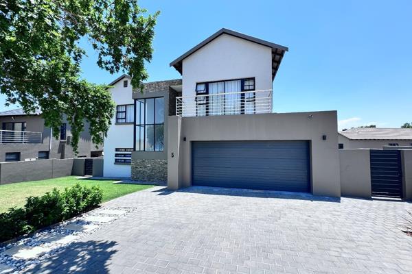 Welcome to this stunning modern contemporary home nestled within the exclusive The Hills ...