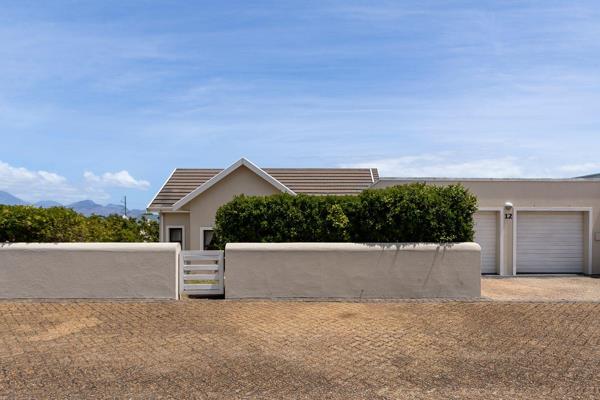 This delightful and sunny 4-bedroom family home, located within a prestigious gated estate in Somerset West, offers the perfect ...