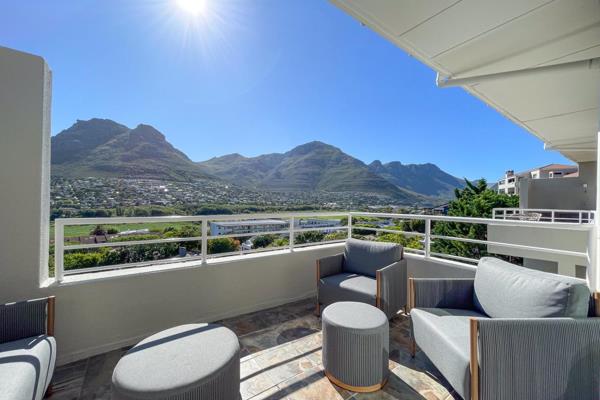 This luxurious 2-bedroom, 2-bathroom apartment in Hout Bay, Cape Town, offers a perfect blend of comfort, style, and breathtaking ...